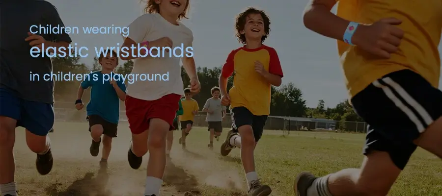 children using elastic wristbands in children's playground children using elastic wristbands in children's playground